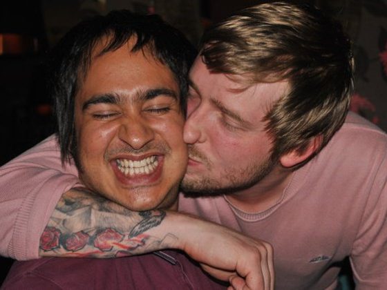 On a messy night out, back in approximately 2010, Flav is kissing Ricky's cheek.