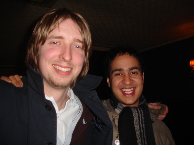 Flav and Ricky in a pub, both with long indie hair back in the day.
